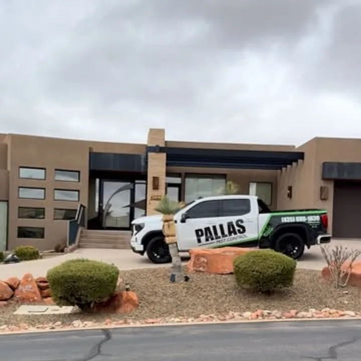 The Pallas Pest Control truck outside a modern St. George desert home